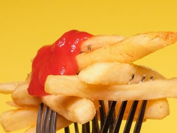 period pain foods french fries on a fork